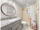 Bathroom featuring updated vanity, toilet and shower/tub combo with curtain at 5906 Sw 108Th St, Ocala, FL 34476