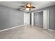 Bedroom features a tiled floor and closet for storage at 5906 Sw 108Th St, Ocala, FL 34476