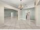Open dining area with chandelier, tile flooring, and view to kitchen and living spaces at 5906 Sw 108Th St, Ocala, FL 34476