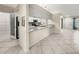 Kitchen pass-through features granite counters, stainless appliances and open access to living areas at 5906 Sw 108Th St, Ocala, FL 34476