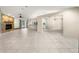Spacious living room with stone fireplace, tile floors, and open layout at 5906 Sw 108Th St, Ocala, FL 34476