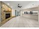 Open-concept living space with fireplace and seamless access to the updated kitchen at 5906 Sw 108Th St, Ocala, FL 34476