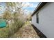 View of the backyard fence and garden bed along the side of the home at 644 Sw 2Nd St, Ocala, FL 34471