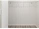 Spacious walk-in closet with installed shelving and modern wood-look flooring at 644 Sw 2Nd St, Ocala, FL 34471