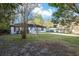 Charming single-story home with a well-manicured lawn and long driveway at 644 Sw 2Nd St, Ocala, FL 34471