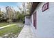 Exterior view of home with gray paint, red shutters, and landscaping at 644 Sw 2Nd St, Ocala, FL 34471