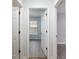 Hallway view leading to a bedroom with laminate wood flooring at 644 Sw 2Nd St, Ocala, FL 34471