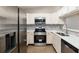 Modern kitchen featuring stainless steel appliances, quartz countertops, and tile backsplash at 644 Sw 2Nd St, Ocala, FL 34471