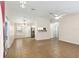 Open-concept living area with tile flooring and seamless flow to dining area, and kitchen at 644 Sw 2Nd St, Ocala, FL 34471