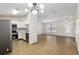 Spacious living room featuring tile floors, an open concept, and stainless steel appliances in the kitchen at 644 Sw 2Nd St, Ocala, FL 34471