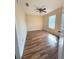 Cozy bedroom featuring wood-look floors, a ceiling fan, and a window at 6611 Sw 80Th Ave, Ocala, FL 34481