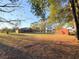 A grassy lawn surrounds the house, garage, and pavilion at 6611 Sw 80Th Ave, Ocala, FL 34481