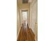 Hallway with wood-look flooring connecting various rooms in the house at 6611 Sw 80Th Ave, Ocala, FL 34481