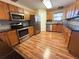 Well-equipped kitchen with stainless steel appliances, wood cabinets, and sleek countertops at 6611 Sw 80Th Ave, Ocala, FL 34481