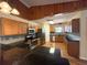 Well-lit kitchen featuring wood cabinets, granite countertops, and stainless steel appliances at 6611 Sw 80Th Ave, Ocala, FL 34481