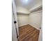 Walk-in closet with wood-look floors and shelving for ample storage at 6611 Sw 80Th Ave, Ocala, FL 34481