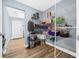 Walk-in pantry with wood-look floors and wire shelving for organized storage solutions at 6875 Se 11Th Pl, Ocala, FL 34472