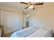Bright bedroom with a large closet, ceiling fan, and a view into the living area, promoting spaciousness at 7772 Sw 146Th Lane Rd, Ocala, FL 34473
