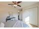 Inviting bedroom with ample natural light, a ceiling fan, a desk and a closet space at 7772 Sw 146Th Lane Rd, Ocala, FL 34473