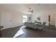 Bright living room with hardwood floors, neutral color palette, and seamless flow to other living areas at 7772 Sw 146Th Lane Rd, Ocala, FL 34473