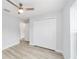 Bedroom featuring wood-look floors, a ceiling fan, and a closet at 800 Marion Oaks Mnr, Ocala, FL 34473