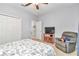 Cozy bedroom features neutral walls, ceiling fan, and comfortable furnishings at 8245 Sw 78Th Terrace Rd, Ocala, FL 34476