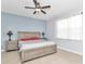 Relaxing bedroom with neutral walls, ceiling fan, and bedside tables at 8245 Sw 78Th Terrace Rd, Ocala, FL 34476