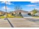 Charming single-story home showcasing a well-manicured lawn, a two car garage, and attractive landscaping at 8245 Sw 78Th Terrace Rd, Ocala, FL 34476