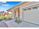 Exterior view of a home, showcasing the entrance with pillars and a two car garage at 8245 Sw 78Th Terrace Rd, Ocala, FL 34476