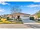 Charming single-story home with a well-manicured lawn and attached two car garage at 8245 Sw 78Th Terrace Rd, Ocala, FL 34476