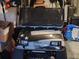 Garage featuring a black golf cart with Yamaha branding, custom lights and a weathered design at 8245 Sw 78Th Terrace Rd, Ocala, FL 34476