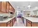 Gourmet kitchen features stainless steel appliances, wooden cabinetry, and spacious countertops at 8245 Sw 78Th Terrace Rd, Ocala, FL 34476