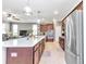 Bright kitchen with stainless steel appliances, breakfast bar, and ample counter space at 8245 Sw 78Th Terrace Rd, Ocala, FL 34476