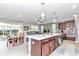 Open-concept kitchen with stainless appliances, granite countertops, and center island at 8245 Sw 78Th Terrace Rd, Ocala, FL 34476