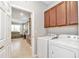 Convenient laundry room with washer, dryer, and cabinets for storage at 8245 Sw 78Th Terrace Rd, Ocala, FL 34476