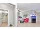 Cozy living area with a plush red chair, adjacent to a full bathroom at 8245 Sw 78Th Terrace Rd, Ocala, FL 34476