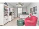 Bright office space with built-in bookshelves, desk, and sitting area at 8245 Sw 78Th Terrace Rd, Ocala, FL 34476