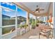 Enclosed patio with ample seating and outdoor dining area at 8245 Sw 78Th Terrace Rd, Ocala, FL 34476