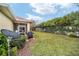 Expansive backyard with a screened lanai and mature landscaping for privacy at 8670 Sw 88Th Pl, Ocala, FL 34481
