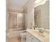 Bathroom featuring a tub and shower combination with decorative wallpaper at 8670 Sw 88Th Pl, Ocala, FL 34481