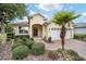 Charming single-story home featuring a manicured front yard and a welcoming entrance at 8670 Sw 88Th Pl, Ocala, FL 34481