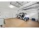Spacious garage with storage racks, a sink, and a unique vehicle at 8670 Sw 88Th Pl, Ocala, FL 34481