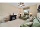 Cozy living room with comfortable seating, decorative fireplace, and natural light at 8670 Sw 88Th Pl, Ocala, FL 34481