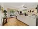 Cozy living room with comfortable seating and sliding glass doors to the lanai at 8670 Sw 88Th Pl, Ocala, FL 34481