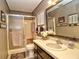 Bathroom featuring a shower, toilet, vanity, and a large mirror at 8888 Sw 95Th Ln # D, Ocala, FL 34481