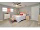 Comfortable bedroom with a large window, ceiling fan, and a nightstand at 8888 Sw 95Th Ln # D, Ocala, FL 34481
