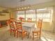 Dining room with a large window, unique light fixture, and hardwood-style floors at 8888 Sw 95Th Ln # D, Ocala, FL 34481