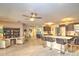 Open floor plan with kitchen island seating that looks into the connected living room at 8888 Sw 95Th Ln # D, Ocala, FL 34481