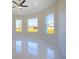 Spacious bedroom with marble floors, tray ceilings and large windows offering plenty of natural light at 9594 Se 61St Ter, Belleview, FL 34420