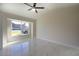Bright bedroom features large windows, neutral paint and sleek marble flooring, enhancing the space at 9594 Se 61St Ter, Belleview, FL 34420
